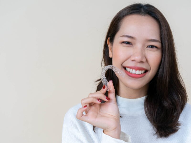 asian woman with invisible braces